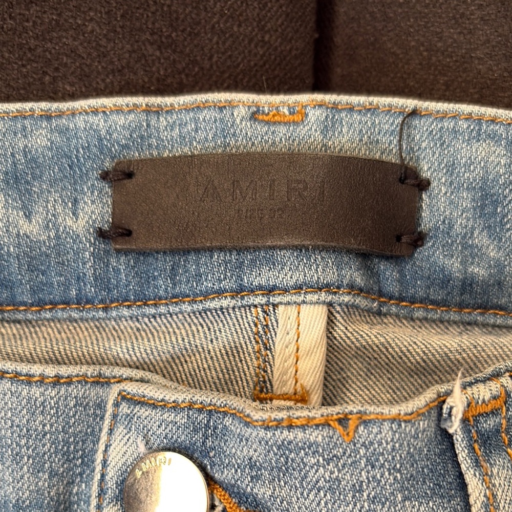 Distressed Light Blue Jeans With Patch - image 2